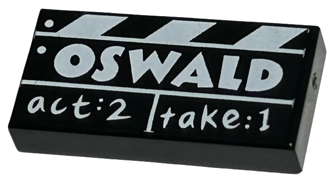 Black Tile 1 x 2 with Film Slate with White 'OSWALD' and 'act:2 take:1' Pattern
